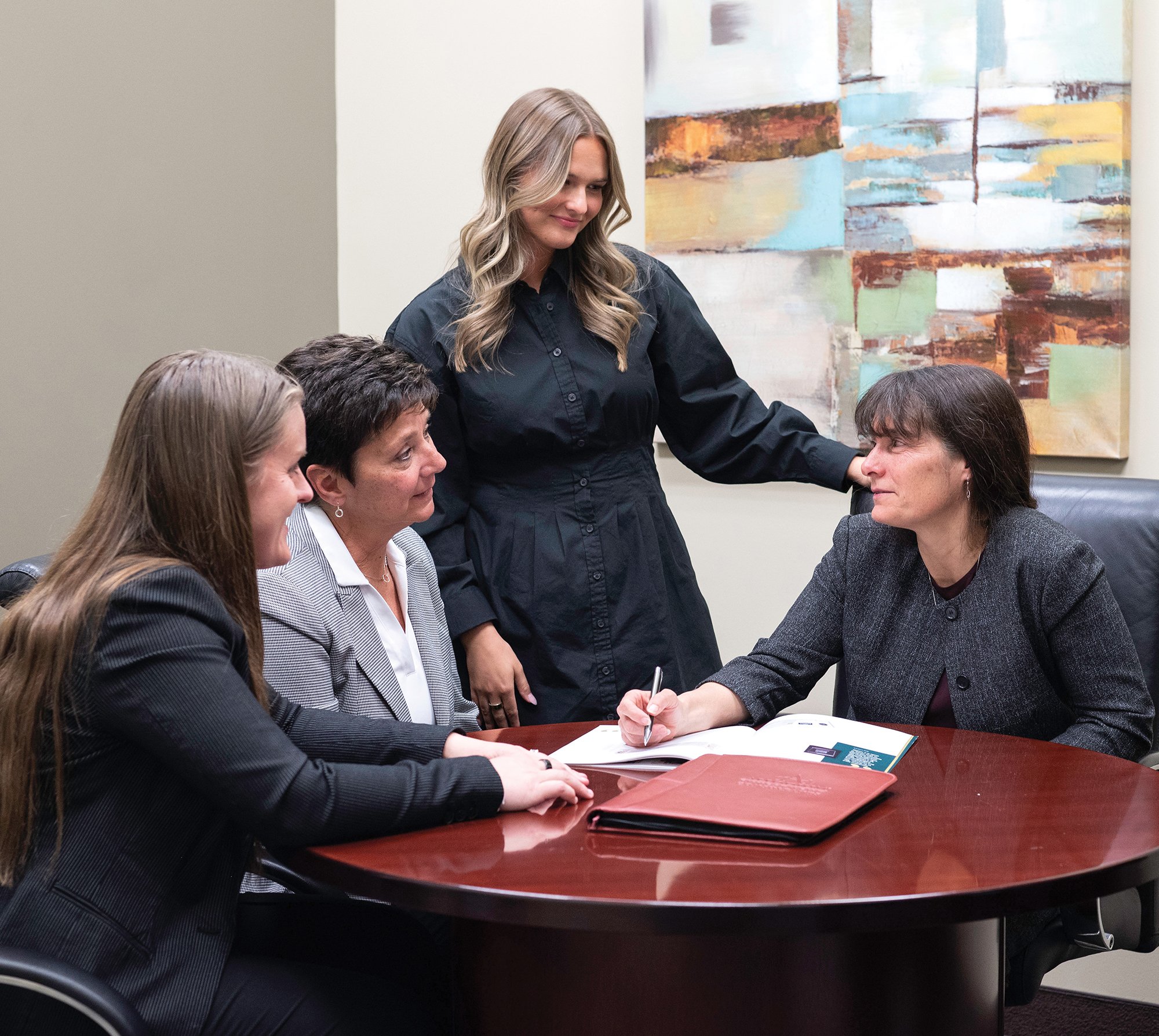 Allodium team members collaborating to support clients through Allodium Portfolios