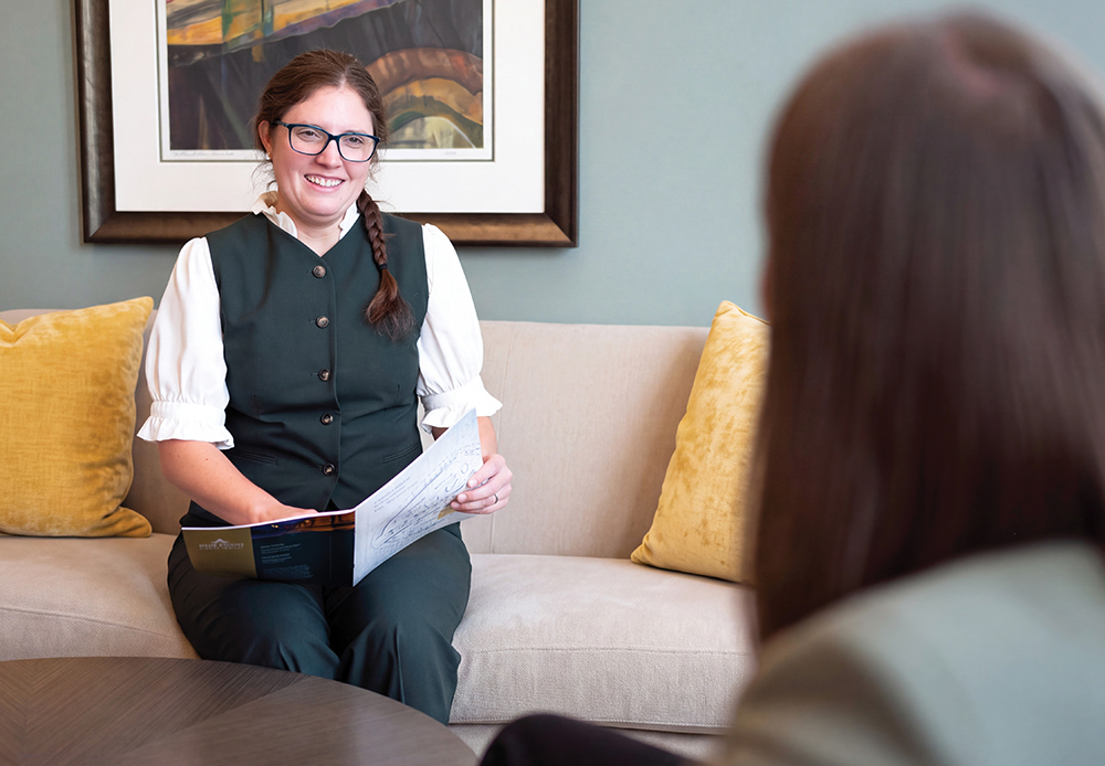 Advisor speaking to a person about our services
